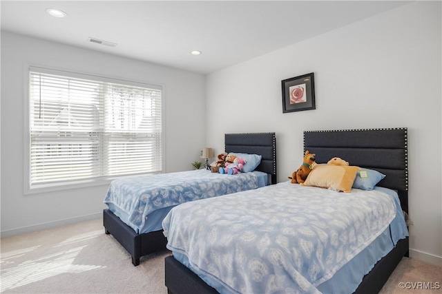 carpeted bedroom with recessed lighting, visible vents, and baseboards