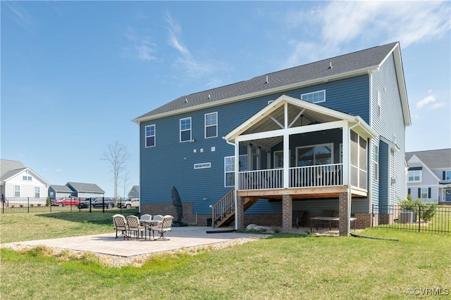 back of property featuring a sunroom, a patio area, fence, and a lawn