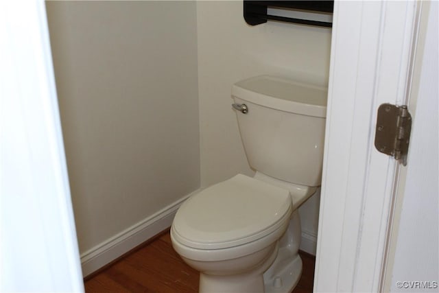 bathroom featuring toilet and wood finished floors