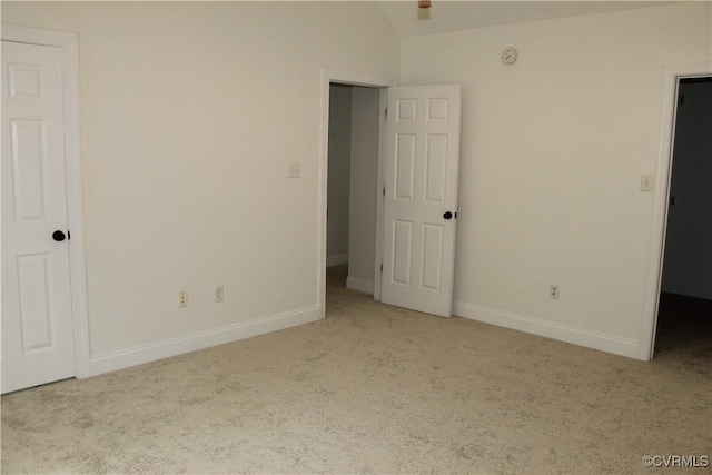 unfurnished bedroom featuring baseboards and carpet flooring