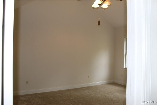 carpeted empty room featuring baseboards and ceiling fan