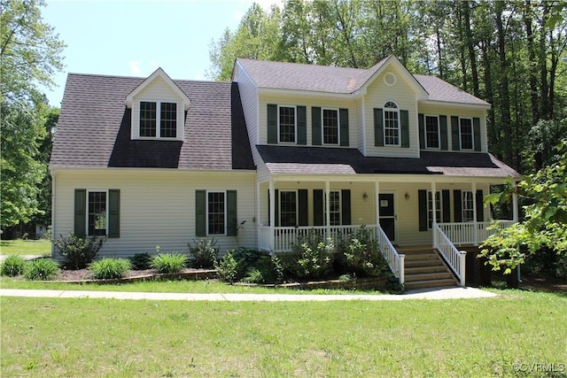 colonial inspired home featuring a front yard and a porch