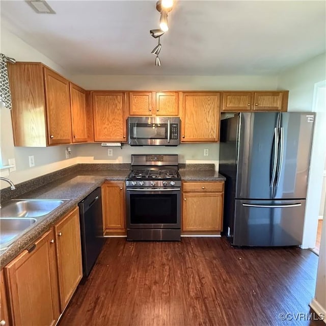 1353 Woodside Mews, Henrico, VA 23231 - kitchen with appliances with stainless steel finishes, dark wood-style flooring, a sink, and dark countertops