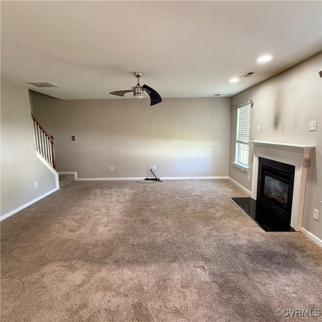 1353 Woodside Mews, Henrico, VA 23231 - unfurnished living room featuring stairway, carpet floors, a fireplace with flush hearth, visible vents, and ceiling fan