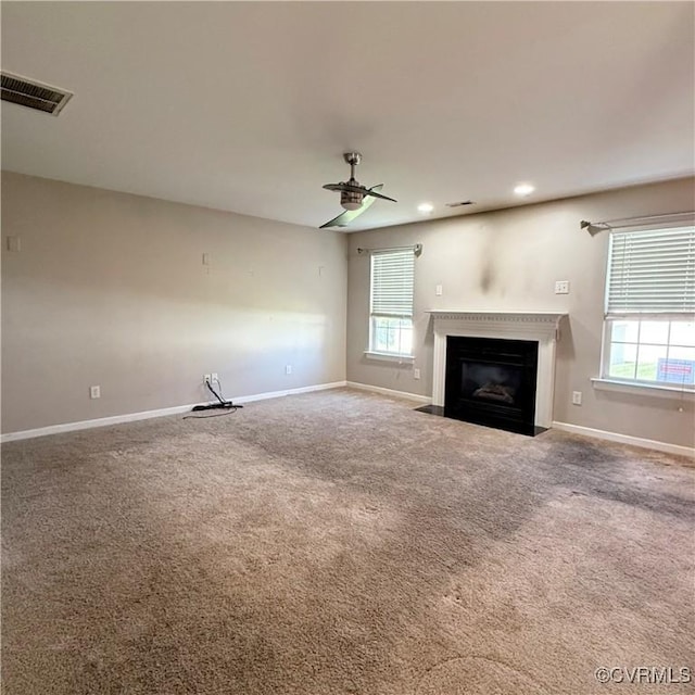 1353 Woodside Mews, Henrico, VA 23231 - unfurnished living room featuring baseboards, carpet flooring, a fireplace with flush hearth, visible vents, and ceiling fan