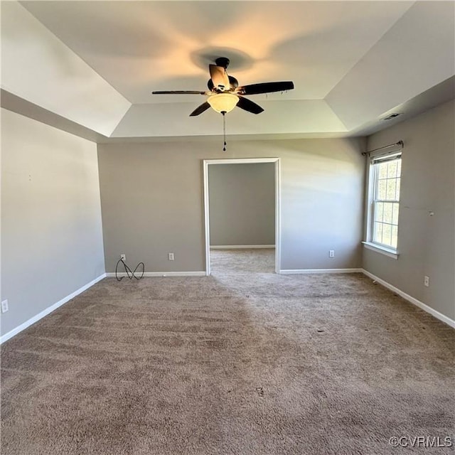 1353 Woodside Mews, Henrico, VA 23231 - empty room with a tray ceiling, baseboards, and a ceiling fan