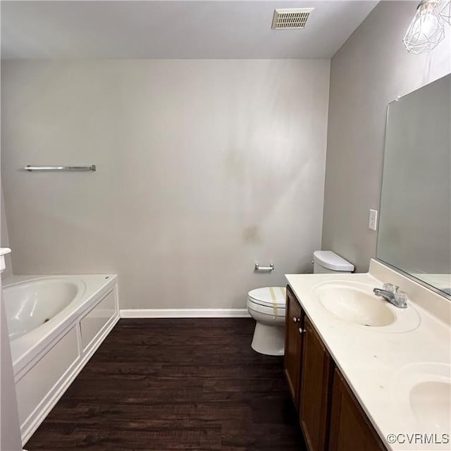 1353 Woodside Mews, Henrico, VA 23231 - bathroom featuring toilet, a bath, visible vents, a sink, and wood finished floors