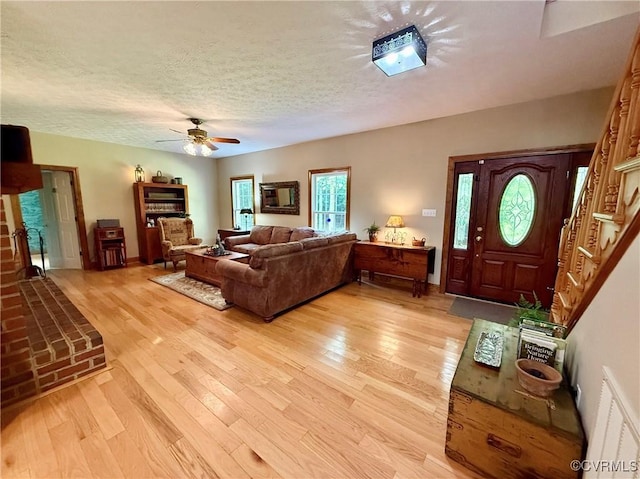 2222 Green Level Rd, King William, VA 23086 - living area featuring light wood-style floors, ceiling fan, and a textured ceiling