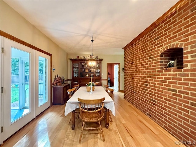 2222 Green Level Rd, King William, VA 23086 - dining space featuring brick wall and light wood-style flooring