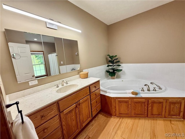2222 Green Level Rd, King William, VA 23086 - full bath with vanity, wood finished floors, a garden tub, and a shower with curtain