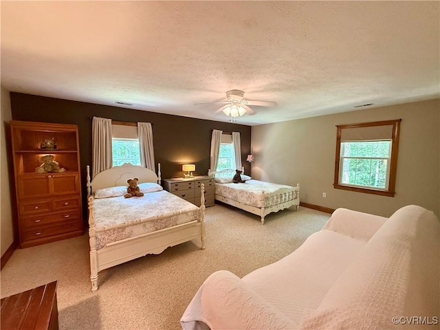 2222 Green Level Rd, King William, VA 23086 - bedroom featuring multiple windows, light carpet, and a ceiling fan