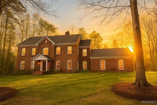 2222 Green Level Rd, King William, VA 23086 - colonial inspired home with a chimney, brick siding, and a front yard
