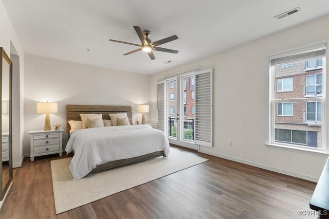 5007 Old Main St, Henrico, VA 23231 - bedroom with wood finished floors, baseboards, access to outside, and a ceiling fan