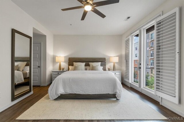 5007 Old Main St, Henrico, VA 23231 - bedroom featuring multiple windows, access to outside, dark wood-style floors, and baseboards