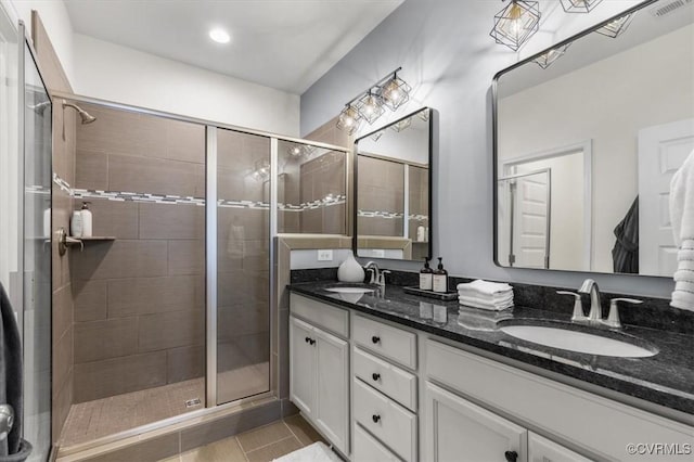 5007 Old Main St, Henrico, VA 23231 - bathroom with double vanity, a shower stall, and tile patterned floors