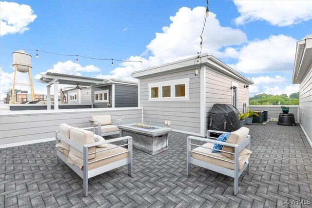5007 Old Main St, Henrico, VA 23231 - view of patio / terrace with a fire pit, a grill, and central AC