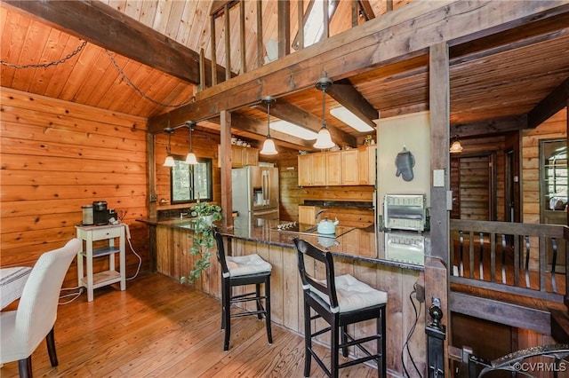 1115 Old Church Rd, Hanover, VA 23111 - kitchen with wood ceiling, stainless steel refrigerator with ice dispenser, wood walls, beam ceiling, and light wood-style flooring