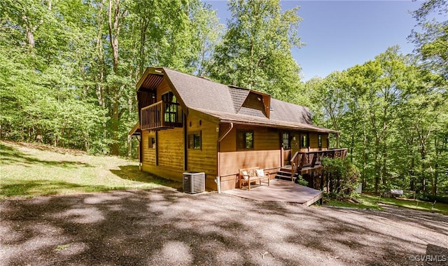 1115 Old Church Rd, Hanover, VA 23111 - view of side of home featuring a shingled roof, a wooden deck, and cooling unit