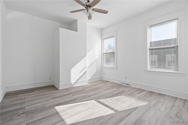 3153 Decatur St, Richmond, VA 23224 - spare room with wood finished floors, baseboards, a ceiling fan, and visible vents