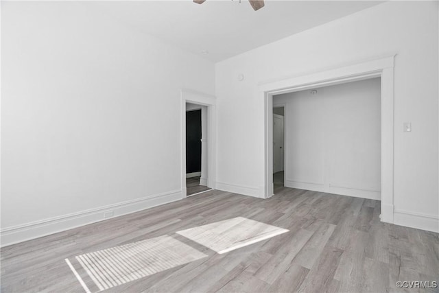 3153 Decatur St, Richmond, VA 23224 - unfurnished bedroom with wood finished floors, ceiling fan, and baseboards