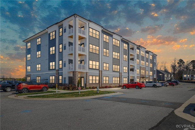 view of property featuring uncovered parking