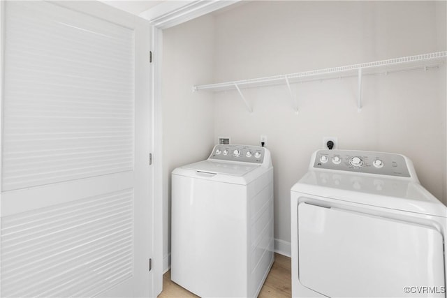 laundry room with washer and dryer and laundry area