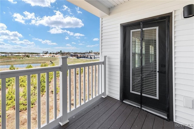 balcony featuring a water view