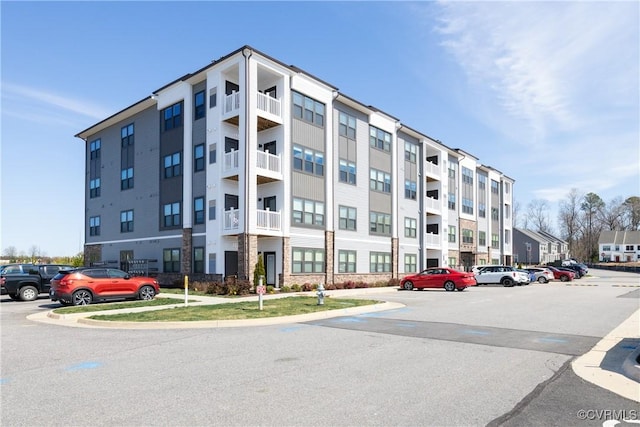 view of property with uncovered parking