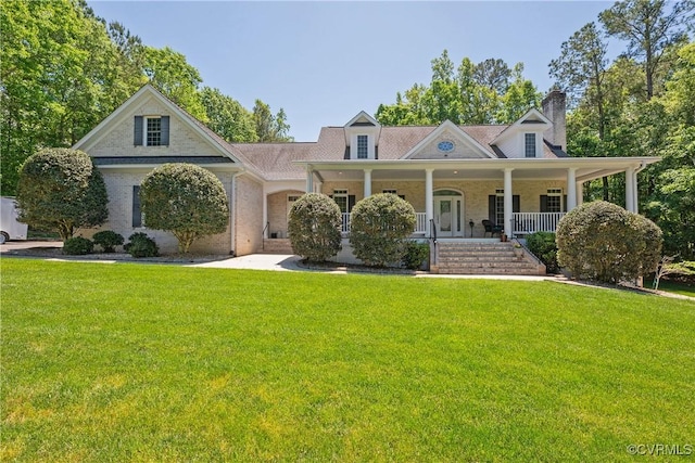 8907 First Branch Ln, Chesterfield, VA 23838 - view of front of property featuring a chimney, a front lawn, and covered porch