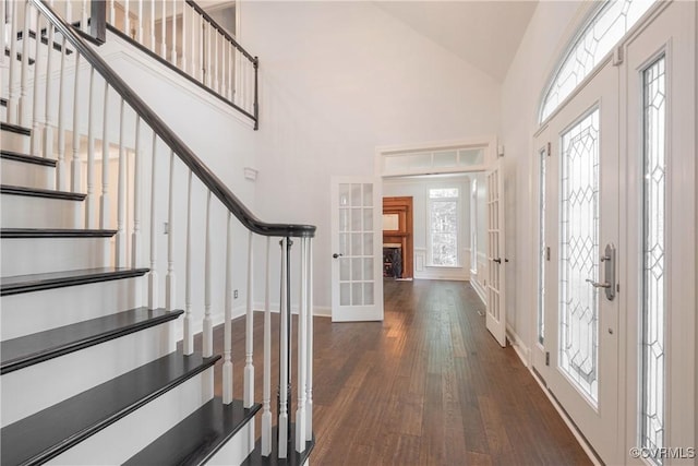 8907 First Branch Ln, Chesterfield, VA 23838 - foyer entrance featuring stairway, high vaulted ceiling, french doors, dark wood-type flooring, and baseboards