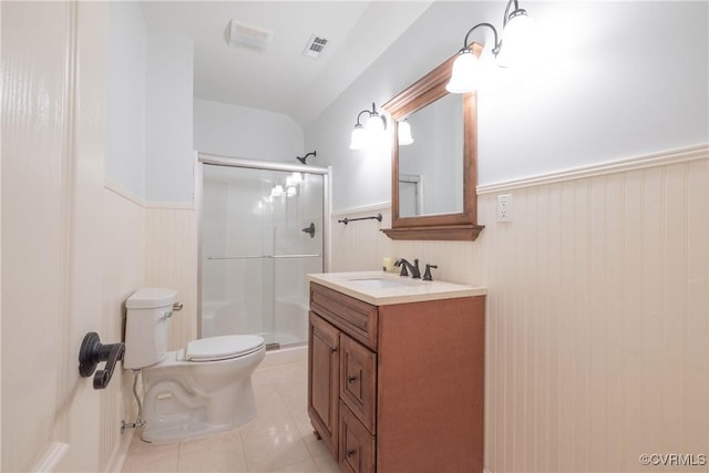 8907 First Branch Ln, Chesterfield, VA 23838 - full bathroom featuring a wainscoted wall, a stall shower, toilet, vanity, and tile patterned floors