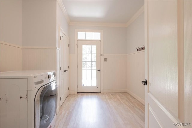 8907 First Branch Ln, Chesterfield, VA 23838 - clothes washing area featuring washer / dryer, a wainscoted wall, light wood-style flooring, healthy amount of natural light, and ornamental molding