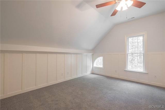 8907 First Branch Ln, Chesterfield, VA 23838 - additional living space with vaulted ceiling, a decorative wall, ceiling fan, carpet, and a wainscoted wall