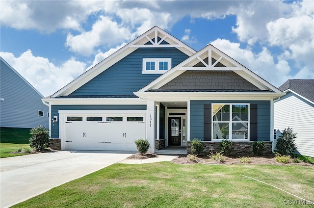 craftsman-style home featuring a garage, driveway, stone siding, and a front yard