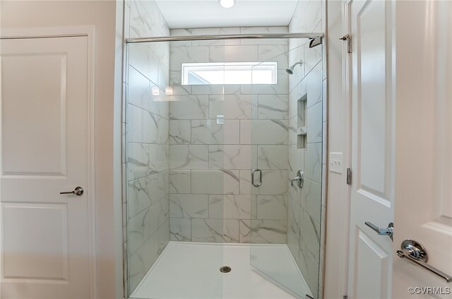 full bath with a shower stall