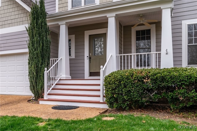 entrance to property with ceiling fan, a porch, and a garage