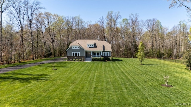 17248 Ivory Bill Ln, Chesterfield, VA 23838 - view of front of home featuring a wooded view, a front lawn, and covered porch
