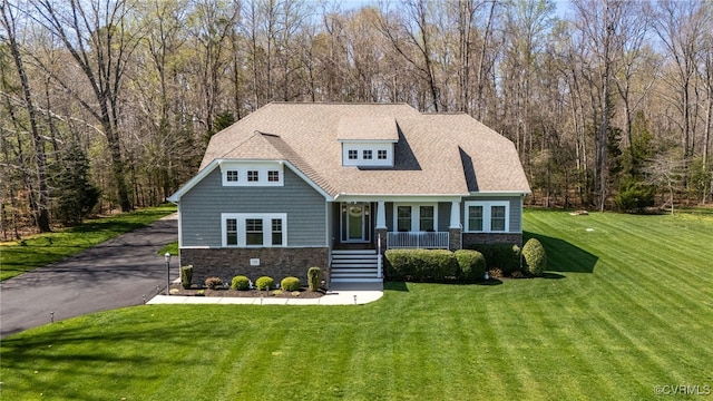 17248 Ivory Bill Ln, Chesterfield, VA 23838 - view of front of house featuring a porch, a shingled roof, stone siding, and a front lawn