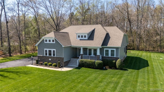 17248 Ivory Bill Ln, Chesterfield, VA 23838 - view of front of property featuring a porch, a shingled roof, a front yard, and stone siding