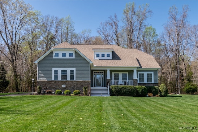 17248 Ivory Bill Ln, Chesterfield, VA 23838 - view of front of home featuring a front lawn, stone siding, covered porch, and roof with shingles