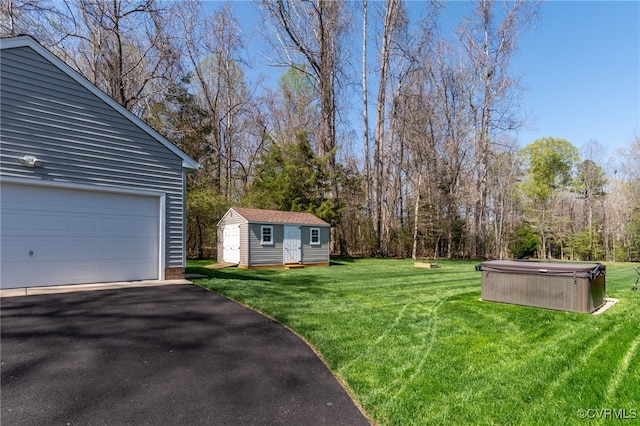 17248 Ivory Bill Ln, Chesterfield, VA 23838 - view of yard featuring a garage, an outdoor structure, and a hot tub
