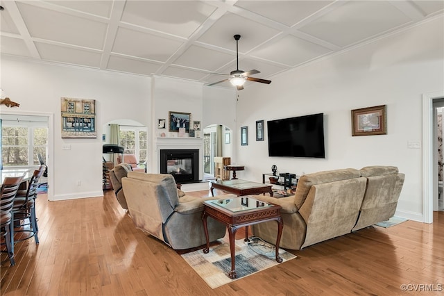 17248 Ivory Bill Ln, Chesterfield, VA 23838 - living room with light wood-style flooring, ceiling fan, arched walkways, and coffered ceiling