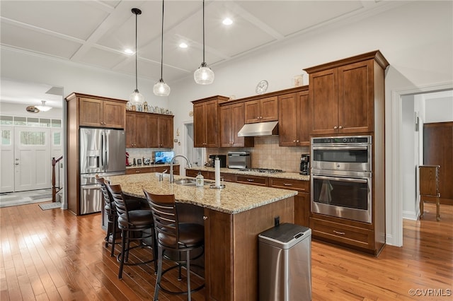 17248 Ivory Bill Ln, Chesterfield, VA 23838 - kitchen featuring coffered ceiling, light wood-style floors, under cabinet range hood, and stainless steel appliances