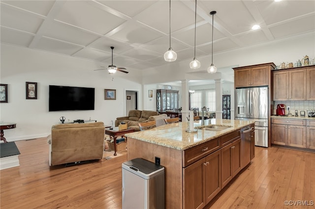 17248 Ivory Bill Ln, Chesterfield, VA 23838 - kitchen with ornate columns, a ceiling fan, a sink, stainless steel appliances, and coffered ceiling