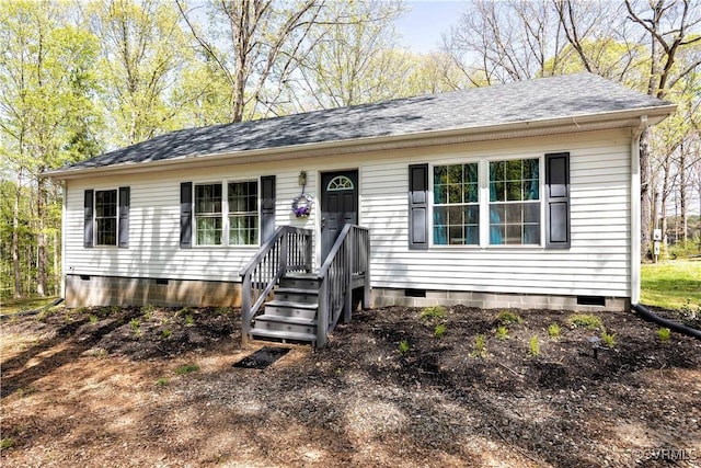 ranch-style house featuring roof with shingles and crawl space
