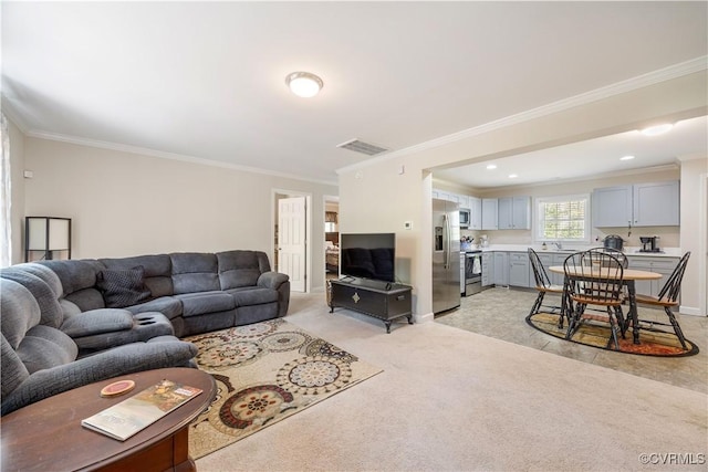 living room featuring visible vents, crown molding, and light colored carpet