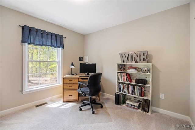 home office with visible vents, baseboards, and carpet floors