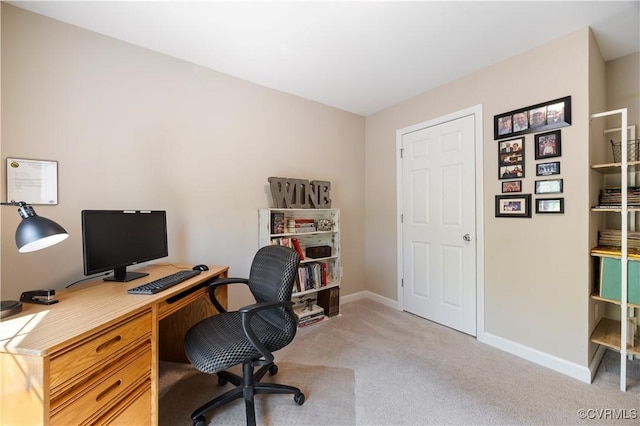 home office featuring light colored carpet and baseboards