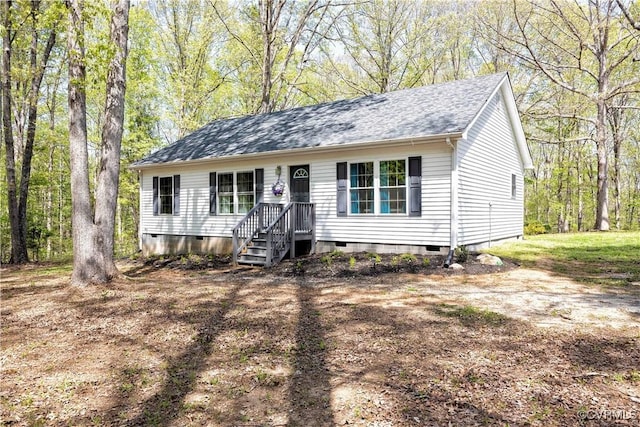 ranch-style house featuring crawl space and a shingled roof