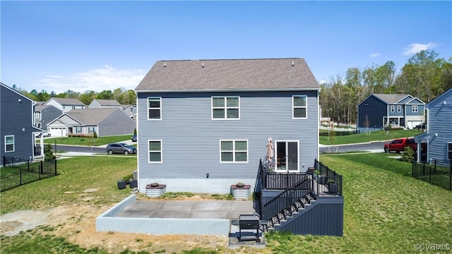 back of house with a yard, a patio, and fence